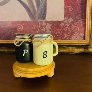 Salt and pepper shakers with the stand.